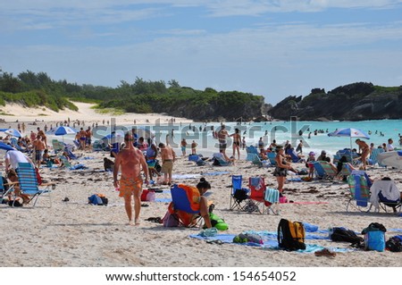 BERMUDA - SEPTEMBER 13: Tourists at Horseshoe Bay Beach in Bermuda, as seen on September 13, 2013. It has been rated the #8 beach in the world by TripAdvisor.