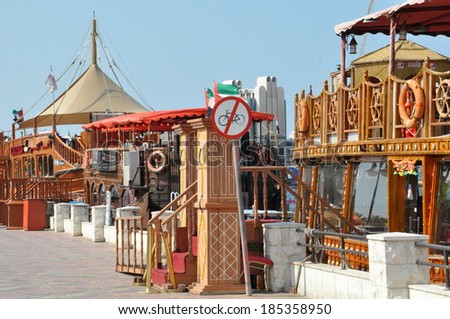 DUBAI, UAE - FEB 13: Boats, abras, dhows at Dubai Creek in the UAE, as seen on Feb 13, 2014. The creek still remains a significant trading hub for goods traded between Iran and The Arabian Peninsula.