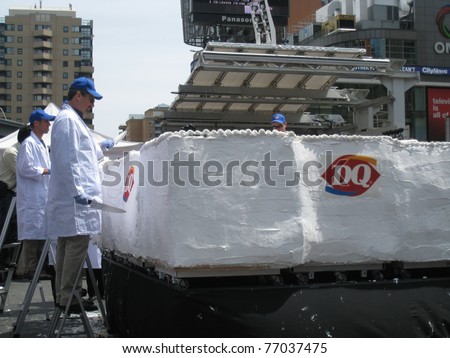 TORONTO - MAY 10: Dairy Queen makes the world's largest ice-cream cake on May 10, 2011 at Yonge Dundas Square in Toronto, Canada.