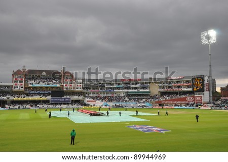 LONDON, UK - SEPTEMBER 9: Covers come on for rains at India vs England, 3rd ODI of India\'s 2011 tour of England, played at the Oval on September 9, 2011 in London, England.