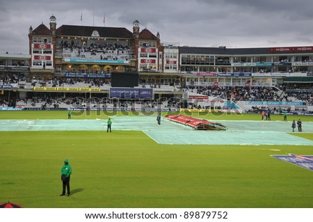 LONDON, UK - SEPTEMBER 9: Rain covers come out to cover the field during India vs England, 3rd ODI of India\'2011 tour of England, played at the Oval on September 9, 2011 in London, England.