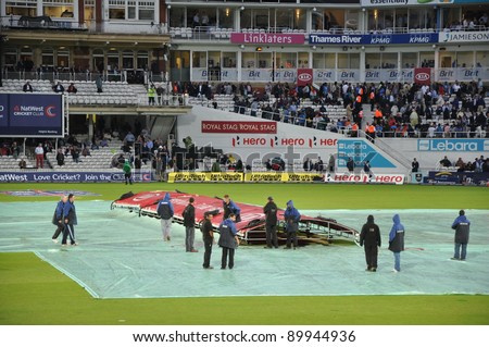 LONDON, UK - SEPTEMBER 9: Covers come on for rains at India vs England, 3rd ODI of India's 2011 tour of England, played at the Oval on September 9, 2011 in London, England.