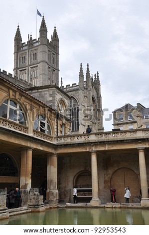 CITY OF BATH, ENGLAND - SEPTEMBER 7: Tourists at the ancient Roman Bath Museum in West England on Sept 7, 2011. The Baths are a major tourist attraction & receive more than 1 million visitors a year.