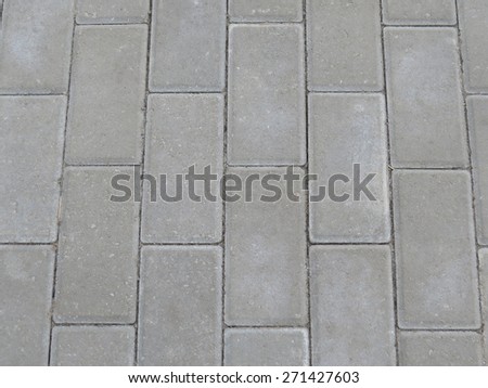 Stone pavers, which are made of the tracks on the street.