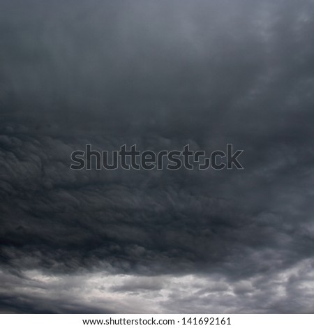 Dark clouds. The stormy clouds over horizon.