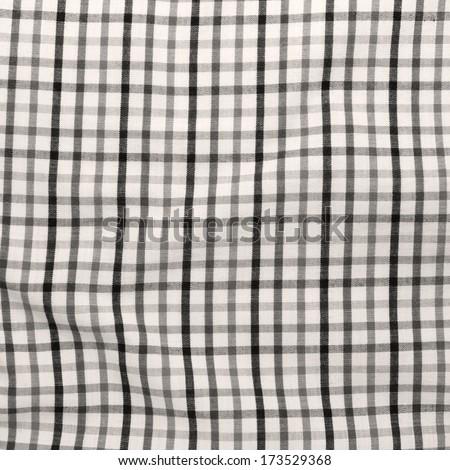 Vintage checkered picnic blanket background. Striped crumpled tablecloth.