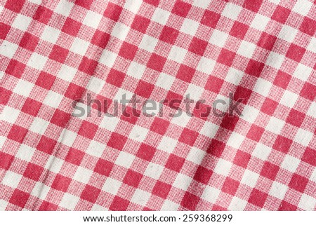 Red and white texture. Red linen checkered tablecloth background.
