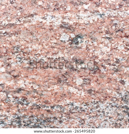 Old red granite background with scratches. Natural granite stone wall texture.