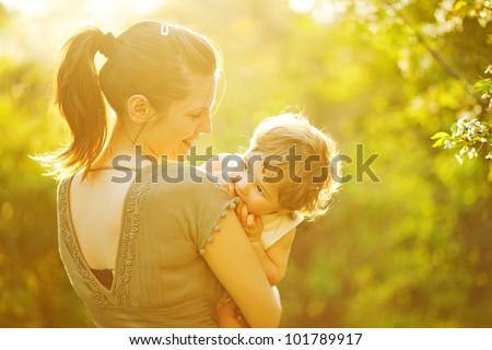 Mother and her child enjoy the early spring