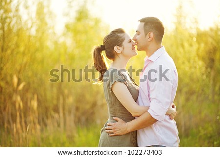 portrait of young happy beautiful couple on nature