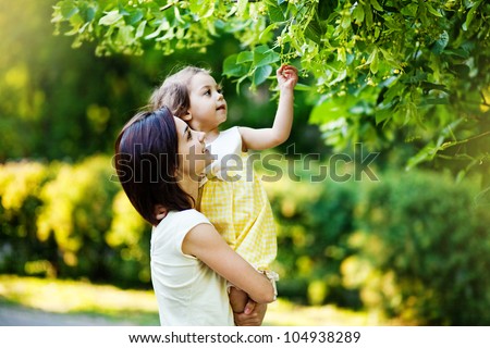 Mother With Daughter In Garden
