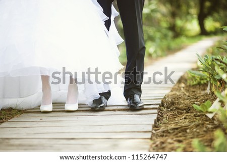 wedding feet (soft focus, focus on shoes of man)