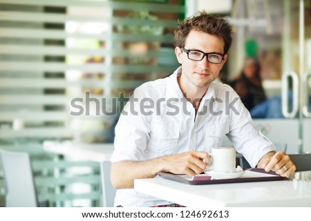 Man in cafe with coffee Man in cafe with coffee