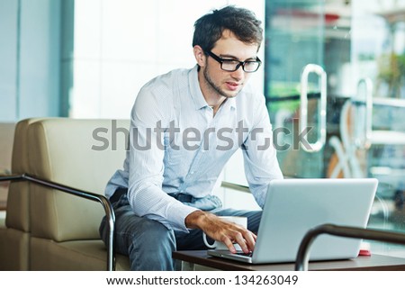 Businessman Sitting In Cafe