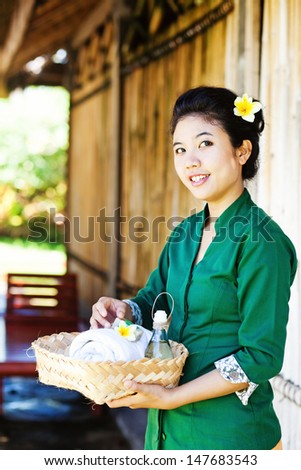 Asian masseuse inviting to salon
