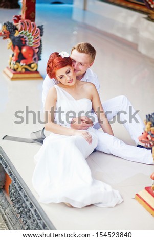 couple in hindu temple on wedding day