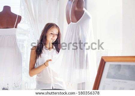 Woman touching a dress