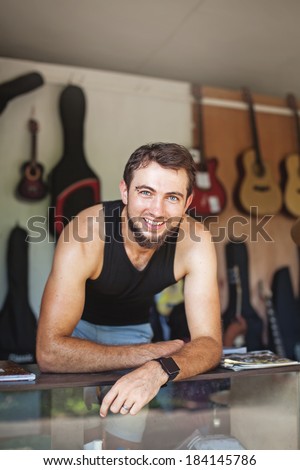 Man working as seller in a music store