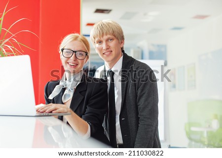 Young employee being trained as a transaction officer