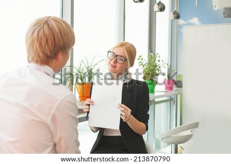 woman showing blank paper