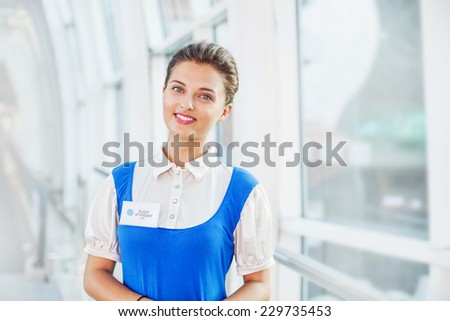 Beautiful young flight attendant in the airport