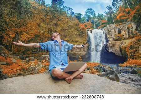 successful man with laptop outdoors