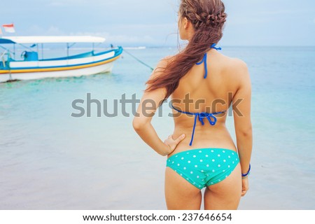 back view of a woman observing the ocean view