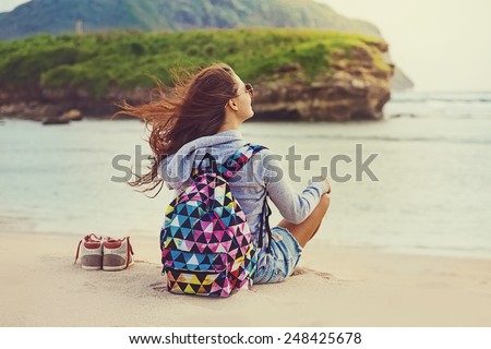 female traveler admiring a marine view (\