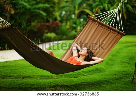 Young beautiful woman in hammock, Bali, Indonesia