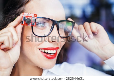 woman wearing smart goggles - futuristic wearables concept