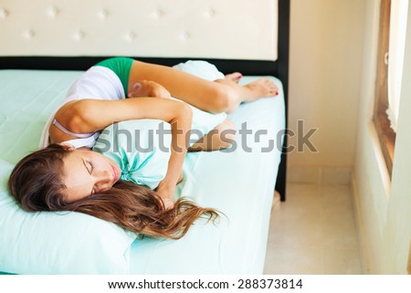 woman sleeping with long pillow