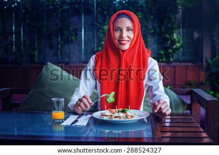 muslim woman enjoying her food after sunset in Ramadan