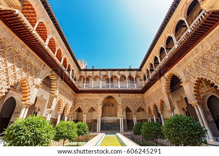 Palace of Alcazar, Famous Andalusian Architecture. Old Arab Palace in Seville, Spain. Ornamented Arch and Column. Famous travel destination.