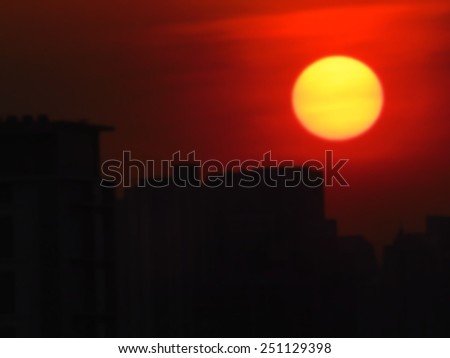 Abstract background. Blurry background of the sunset and the building.