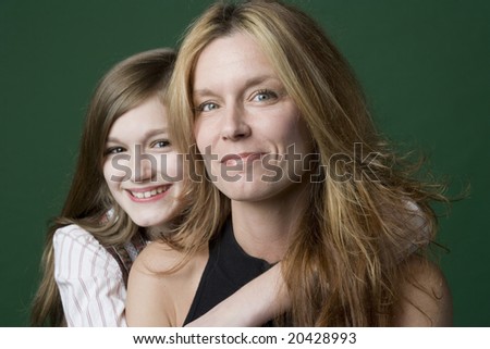 Daughter hugging Mom from behind