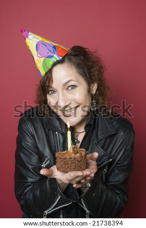 40-something biker woman with her birthday cupcake