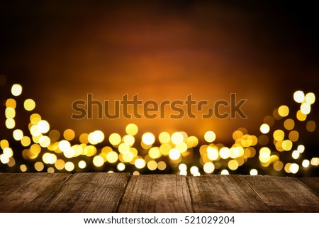 Festive wooden background with glittering bokeh lights, illuminated by a spotlight, ideal for Christmas or other occasions