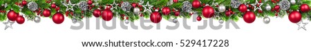 Extra wide Christmas border with fir branches, red and silver baubles, pine cones and other ornaments, isolated on white