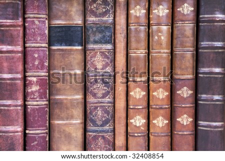 A row of old leather bound book spines