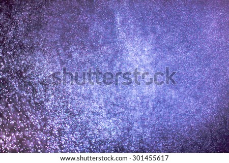abstract dark bokeh lights background , purple,black and subtle gold. defocused background