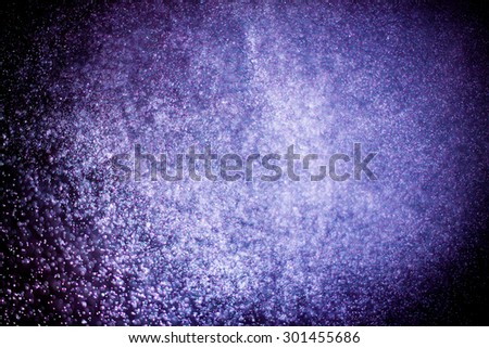 abstract dark bokeh lights background , purple,black and subtle gold. defocused background