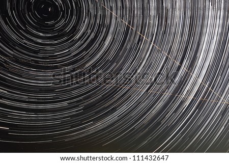 Extreme long exposure image showing star trails around the Polar Star or Polaris.