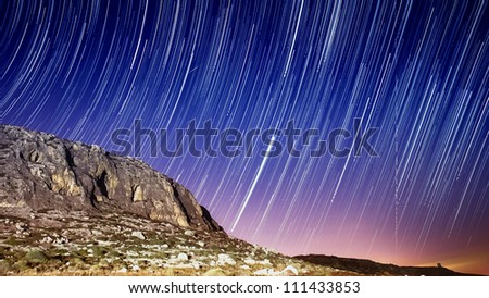 Extreme long exposure image showing star trails around the cliffs at Ghar Lapsi in Malta