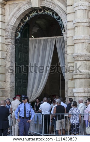 VALLETTA, MALTA - AUG 25 - People pay their last respects to former Prime Minister of Malta Dom Mintoof during his state funeral on 25 August 2012