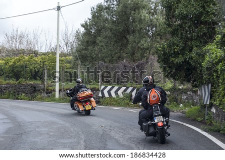 SICILY, ITALY - APRIL 4, 2014: Members of H.O.G. Malta Chapter ride their Harley-Davidson motorcycles in Sicily. Harley Owners Group is made up of various local chapters from around the world.