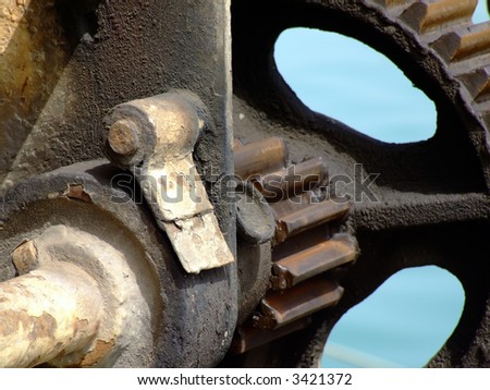 Old quayside hoist crane in Malta, used to lift fish catches off fishing trawlers - detail of cog wheel mechanism