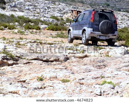 Small offroad vehicle on hard and tough Mediterranean trek