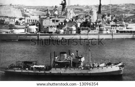 WWII battleship from the Royal Navy in harbour in Malta during the same era