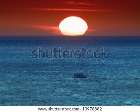 A sailing boat during a winter Mediterranean sunset