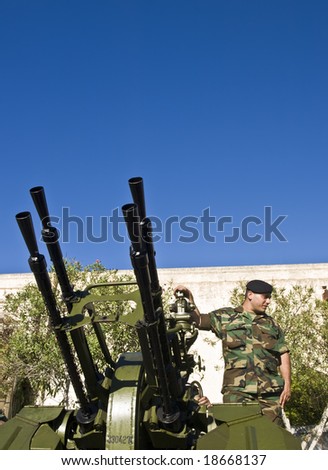 MALTA- OCTOBER 06 - Soldiers demonstrating an Anti-Aircraft Gun during an Armed Forces of Malta open day at Luqa Barracks